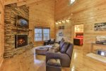 Great room with TV and custom stacked stone fireplace